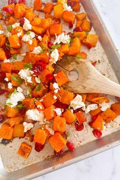 a pan filled with sweet potatoes and feta cheese