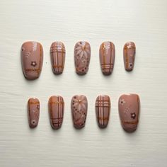 Hand painted, reusable detailed fall flowers and plaid brown and gold press on nails. These nails are made to order and able to be customized to the buyer's request. They come in the provided sizes, or are able to be custom sized based on your nail sizes and shapes. The shapes provided are just the nails that I have already preshaped, but I also have long, unshaped nails that I can manually shape to any length and shape. If you prefer to have custom sizes or shapes, please specify which size and shape and length you would like in the personalization section. Also, if you would like to customize the nail design in any way (colors, design, etc), also specify this in the personalization section. Do not hesitate to message me with any questions or issues! Gold Press On Nails, Plaid Nail Designs, Turkey Nails, Brown Nail Art, Bronze Nails, Plaid Brown, Fall Nail Art Designs, Plaid Nails, Fall Plaid