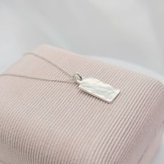 ~ PETITE note measurements  ~ .925 Sterling Silver TINY minimalist hand hammered rectangle bar pendant necklace ~ dainty, petite curb chain also solid .925 Sterling Silver   ~ small/dainty hand hammered pendant measures 10 mm x 6 mm x .80 mm thick Caring For Your  Jewelry Always remove your jewelry prior to bathing, swimming, sleeping, working out. Avoid contact with all chemicals including perfumes and lotions. Clean your jewelry with a jewelry polishing cloth. Store your clean, dry jewelry in Dainty Sterling Silver Charm Necklace With Square Pendant, Minimalist Sterling Silver Charm Necklaces, Tarnish Resistant, Minimalist Sterling Silver Charm Necklace Tarnish Resistant, Minimalist Sterling Silver Charm Necklace, Tarnish Resistant, Minimalist Sterling Silver Charm Necklaces, Sterling Silver Necklace With Rectangular Pendant, Minimalist Tarnish-resistant Oblong Jewelry, Silver Tarnish Resistant Charm Necklace With Rectangular Pendant, Sterling Silver Charm Necklace With Square Pendant