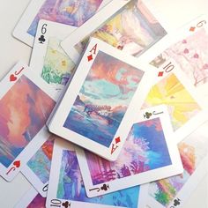 several playing cards with different designs on them