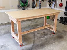 a workbench in a garage with tools hanging on the wall