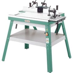 a green and white workbench with tools on it's legs, sitting on top of a shelf