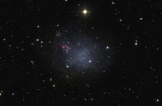 an image of a star cluster in the night sky with stars all around it and some bright lights