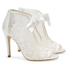 Ladylike and lovely, Nikki ribbon tie lace bootie shows extra skin with a peep toe and deep cutout down the front. A garden of intricate Damask roses made of lace bloom across the foo Shoes For Brides, Belle Shoes, Fun Wedding Shoes, Wedding Shoes Comfortable, Ivory Wedding Shoes, Lace Booties, Wedding Shoes Lace, Perfect Blue, Bridal Heels