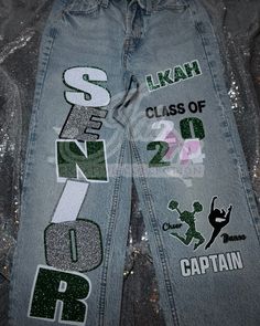 the back side of a pair of jeans with sequins and letters on them