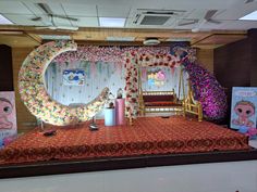 the stage is decorated with flowers and decorations