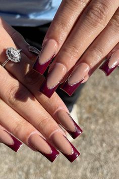 When it comes to burgundy chrome nails, there are so many design possibilities to choose from. Whether you prefer simple, elegant nails or something more detailed and artistic, the options are endless. Burgundy chrome gives off a high-shine, almost mirror-like effect that’s perfect for showcasing your nail art.  Some popular designs include adding intricate details like metallic stripes, tiny rhinestones, or subtle glitter accents. You can also try geometric patterns or mix in other colors like Dark Burgundy Acrylic Nails, Maroon Nail Tips, Maroon Coffin Nail Ideas, Maroon And Silver Nails Acrylic, Burgundy Birthday Nails, Black And Burgundy Nail Designs, French Tip Dark Red, Nails With Burgundy Dress, Burgundy Acrylic Nails Design