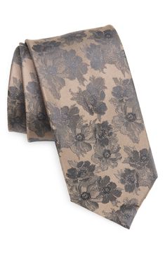 Jacquard-woven flora bring texture and distinction to this handsome silk tie that complements any tailored look. 3" width; 57" length 100% silk Dry clean Imported Classic Formal Ties With Floral Print, Elegant Floral Print Accessories For Black Tie, Elegant Patterned Ties For Formal Occasions, Elegant Formal Patterned Ties, Elegant Patterned Tie With Floral Print, Elegant Patterned Ties For Semi-formal Occasions, Elegant Floral Print Suit And Tie Accessories For Wedding, Black Floral Tie, Burgundy Tie