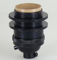 a close up of a camera lens on a white surface with a black plastic holder