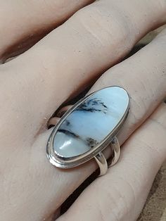 One of a kind, handcrafted, Scenic Peruvian Opal and sterling silver ring.  Size 7.5(one free sizing). Top measures about 29mm X 13mm. Handmade Oval Nature-inspired Ring, Handmade Sterling Silver Opal Ring, Handmade Silver Opal Ring, Handmade Oval Sterling Silver Opal Ring, Handmade Oval Opal Ring In Sterling Silver, Unique Handmade Silver Opal Ring, Handmade Unique Silver Opal Ring, Handmade Artisan Opal Ring In Sterling Silver, Handmade Unique Sterling Silver Opal Ring