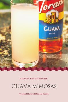 a bottle of guava and a glass filled with liquid