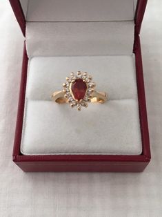 Free Shipping on orders over $35.00 however if there is a return buyer to refund seller for the free shipping cost to seller. Rare 18K Gold 0.75ct Rhodocrosite Gemstone Pear Cut 16 Accent Diamonds Solid 750 Yellow Gold Ring Stunning Beautiful 18K Gold Hallmarked 18K Ring size - 5.75 Visit our shops on Etsy HauteCoutureLaLa TrendsCouture BeautifulPatina LastingTrendsFree Shipping on orders over $35.00 however if there is a return buyer to refund seller for the free shipping cost to seller. Free S Retro Ring, Dec 12, Yellow Gold Bracelet, Gorgeous Bracelet, Yellow Gold Ring, Photo Bracelet, Pear Cut, Cultured Pearls, 10k Gold