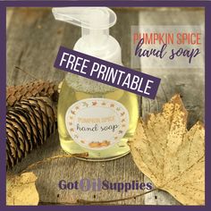 pumpkin spice hand soap with free printable label on wooden table next to autumn leaves