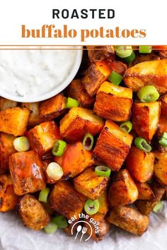 roasted buffalo potatoes with green onions and ranch dressing in a white bowl next to the recipe title