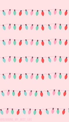 a pink background with small christmas lights on the string and hearts hanging from it's sides