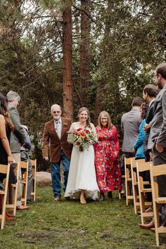 the bride and groom are walking down the aisle