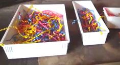 three white boxes filled with different colored confetti