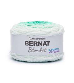 yarn ball in white and green on a white background with the words bernat blanket