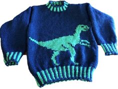 a blue sweater with a green dinosaur on it