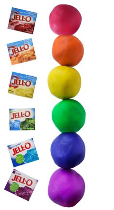 a stack of colorful balls sitting on top of each other next to candy bar wrappers