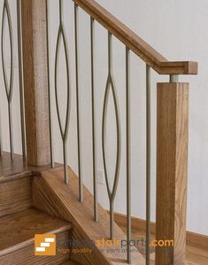 a wooden stair case with metal handrails