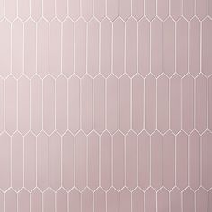 a pink wall with white hexagonal tiles on it