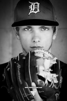 black and white photograph of a baseball player wearing a catchers mitt