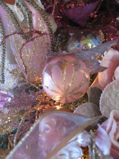 some pink and gold ornaments are on display for the cameraman to take their photo