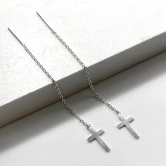 One pair of high quality sterling silver Cross threader earrings. Lightweight and easy to wear, from day to night - they are effortlessly stylish, giving you a up to date and feminine look. Simple yet striking, these fine chain Threader Earrings look stunning on. Just push in and gently pull through. Threader earrings are worn with part of the chain hanging behind the earlobe and the remainder hanging in front. The ultimate in minimalist earrings 💕Details Cross: 7 mm wide Length: approx 60 mm 💕 Online store: www.thejewellerytree.net 💕 Stay up-to-date with new designs & special offers  - FOLLOW ME   Socials: @myjewellerytree OR  https://www.facebook.com/thejewellerytree1/  💕 Need more info, feel free to email - I'd love to help 💕And please visit my store https://www.etsy.com/au/shop/Th Minimalist Silver Linear Earrings For Pierced Ears, Classic Silver Threader Earrings As Gift, Minimalist Hypoallergenic Silver Linear Earrings, Simple Silver Sterling Threader Earrings, Simple Silver Threader Earrings As Gift, Silver Minimalist Threader Drop Earrings, Silver Minimalist Threader Earrings, Minimalist Sterling Silver Threader Earrings For Gift, Silver Threader Earrings For Everyday