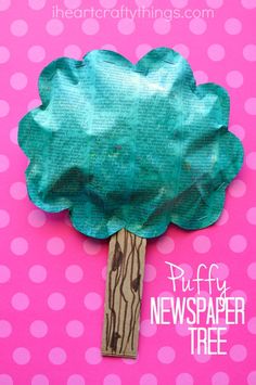 a paper plate tree on top of a pink background with the words puffy newspaper tree