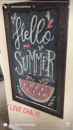 a chalkboard with the words hello summer written on it and a watermelon