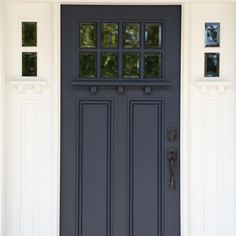 a blue front door with two sidelights