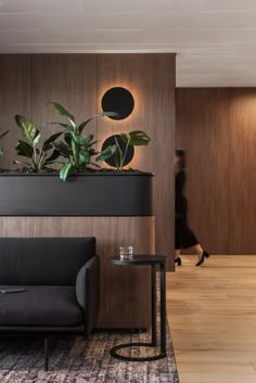 a living room with plants on the wall