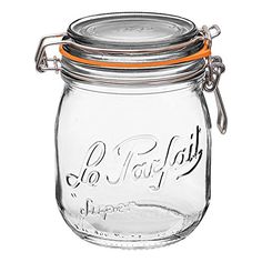 a glass jar with an orange rubber band around the top and bottom, on a white background