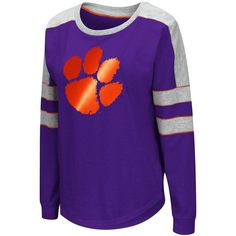 As a devout Clemson Tigers fan, you're always on the hunt for new team gear. Now, you can merge your comfy style and passion for the Clemson Tigers into one by ordering this amazing Trey Dolman T-shirt from Colosseum. Perfect to slip on when you're relaxing, this long sleeve top is made from soft material and boasts bold team graphics on the front. With just one look, people will be able to see that the Clemson Tigers hold a special place in your heart. Back neck taping Brand: Colosseum Contrast Casual Purple Game Day Top, Casual Purple Tops For Game Day, Collegiate Purple Top For Game Day, Purple Crew Neck Fan Gear Top, Purple Crew Neck Top For Fan Gear, Purple Tops For College In Fall, Collegiate Purple Cotton Tops, Purple Collegiate Cotton Tops, Purple Cotton Collegiate Tops