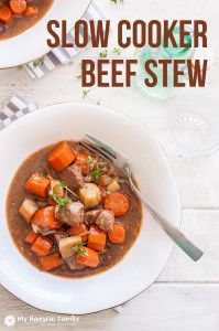 two white bowls filled with beef stew and carrots