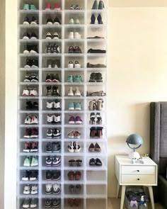 an organized closet filled with lots of shoes