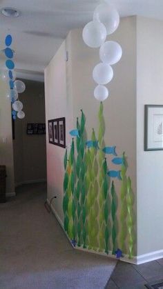 a hallway decorated with paper fish and bubbles