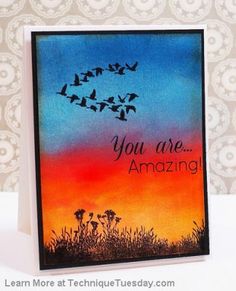 a card with some birds flying in the sky