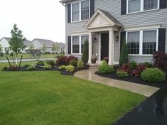 a house with landscaping in the front yard