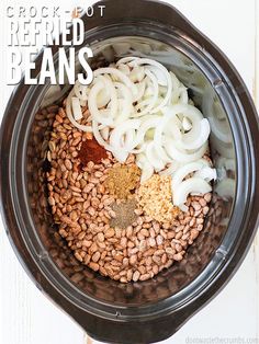 the ingredients in this slow cooker are ready to be mixed with beans and onions