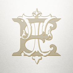 the letter f is made up of fancy lines and swirls in gold on white paper