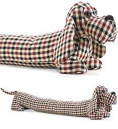 the dog is made out of fabric and it looks like he's laying down