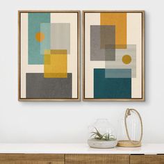 two framed art pieces hanging on the wall above a dresser with a vase and potted plant