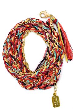 A satin gold plated link chain woven into a 100% cotton & metallic polyester thread braid with thread tassels at each end. The braid colors are red, maroon, rust, mauve, corn, aqua, black & multi metallic. The closure is a satin gold-plated trigger clasp. The total length of the chain is 28.5" (including 2 1/4" extension for size adjustability). This style can be worn as a wrap bracelet, necklace or anklet. The chain wraps approximately 4 times around the wrist (depending on wrist size). Gold Woven Braided Bracelets For Beach, Gold Braided Bracelets For Beach, Red Braided Bohemian Jewelry, Gold Woven Braided Bracelets For Festival, Red Bohemian Woven Braided Bracelets, Bohemian Red Woven Braided Bracelets, Bohemian Red Woven Braided Bracelet, Braid With Thread, Braid Colors