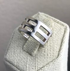 This is an estate sterling silver wide band ring featuring a geometric cut out rib cage design. It is hallmarked 925 and tests positive for sterling silver with the 18K acid solution - a video of testing is available upon request, before purchasing. Weight: 6.07 G Size: 5 ¾ Width: 0.4" (1.0 cm) Very good estate preowned condition (see photos, video). A tarnish-removing, jewelry polishing cloth is included. All jewelry is sold in used, pre-owned condition. Vintage and antique items are expected t Cage Ring, Black Patch, Wide Band Ring, Wide Band Rings, Pretty Gift, Rib Cage, Wide Bands, Antique Items, Band Ring