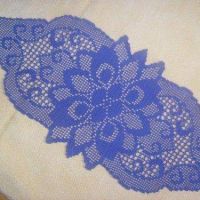 an image of a blue lace on white fabric