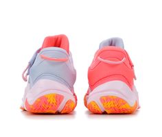 the nike air more uptemod is shown in pink and blue with orange accents