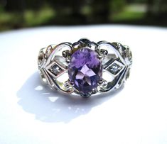 "Ask me about the \"SPECIAL DISCOUNT\" on your purchase of multiple listings/items! All items must be purchased at the same time on one order.   Beautiful delicate motif lacy openwork shanks ring prong set with large genuine amethyst gemstone. Just over 1 carat, oval faceted with dainty diamond accent on each side of shank. Size 8US. Great vintage condition, very little imperfections/age/use/wear. Great alternative engagement ring. 3.73 grams. *All measurements are approximate. Gemstones are tes Purple Amethyst Promise Ring With Vs Clarity, Purple Stuff, Mens Pinky Ring, June Birthstone Ring, Alternative Engagement Ring, Womens Bangles, Faceted Ring, Diamond Accent Ring, Amethyst And Diamond Ring