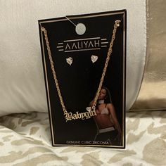 Bran New Aaliyah Babygirl Necklace & Earrings In A Gold Tone And Cz’s. Aaliyah Name Necklace, Aaliyah I Care 4 U, Aaliyah Graphic Tee, Aaliyah T Shirt, Babygirl Necklace, Aaliyah More Than A Woman, Ring Charm Necklace, Love Is My Religion, Diamond Star Necklace